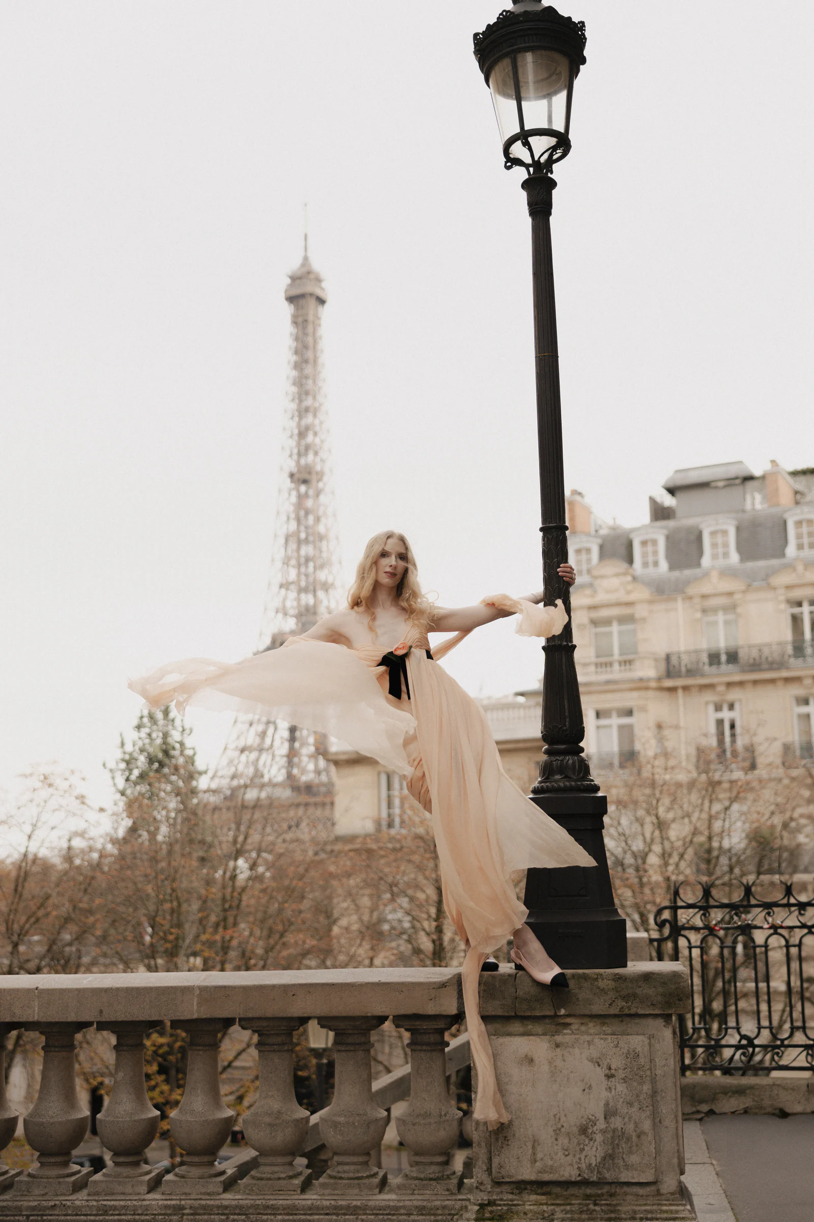 Bride in a pink vintage Chanel gown on a Seine bridge with the Eiffel Tower beyond, Paris