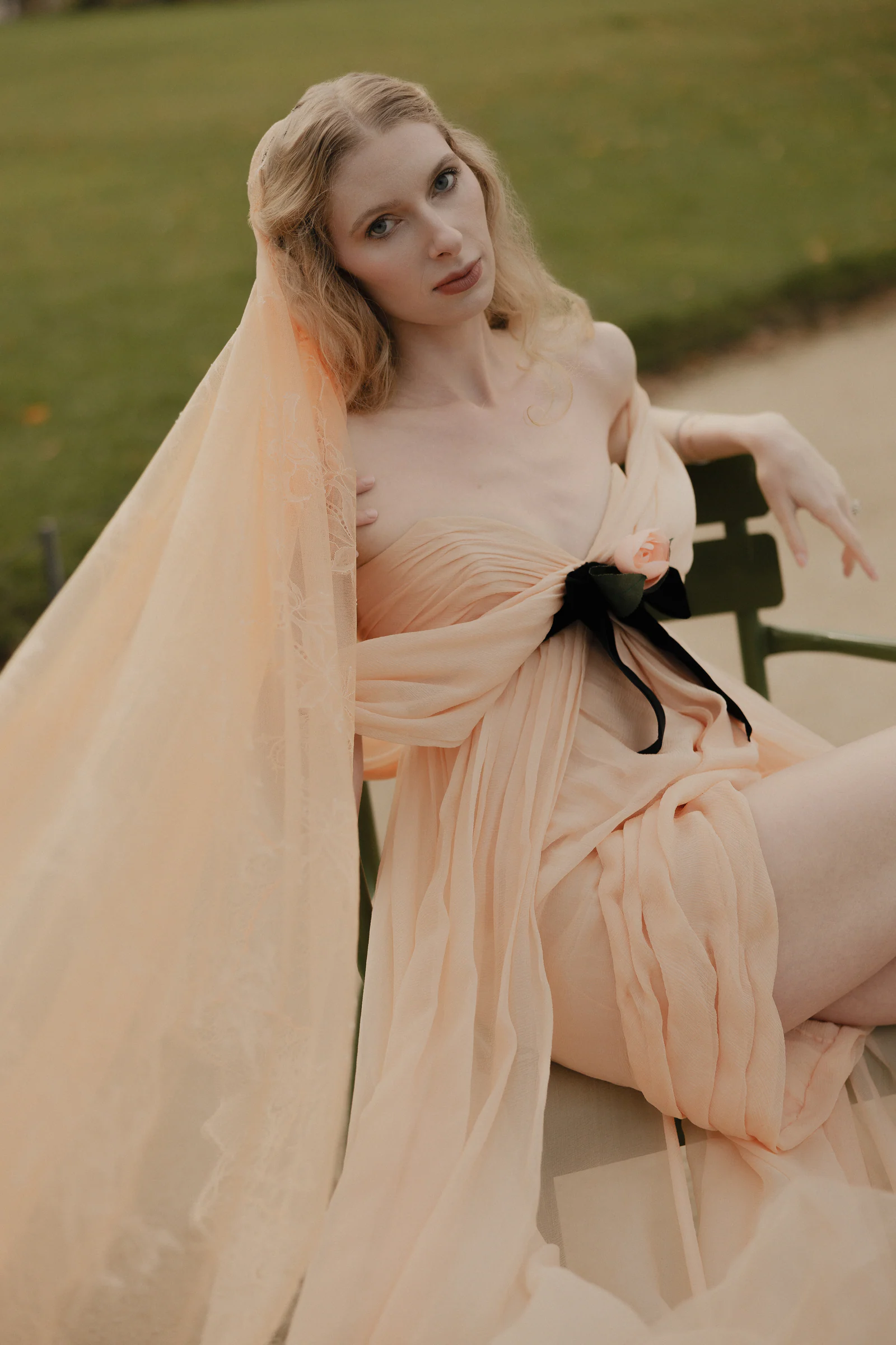 Bride seated on a green Tuileries chair in vintage Chanel, Paris