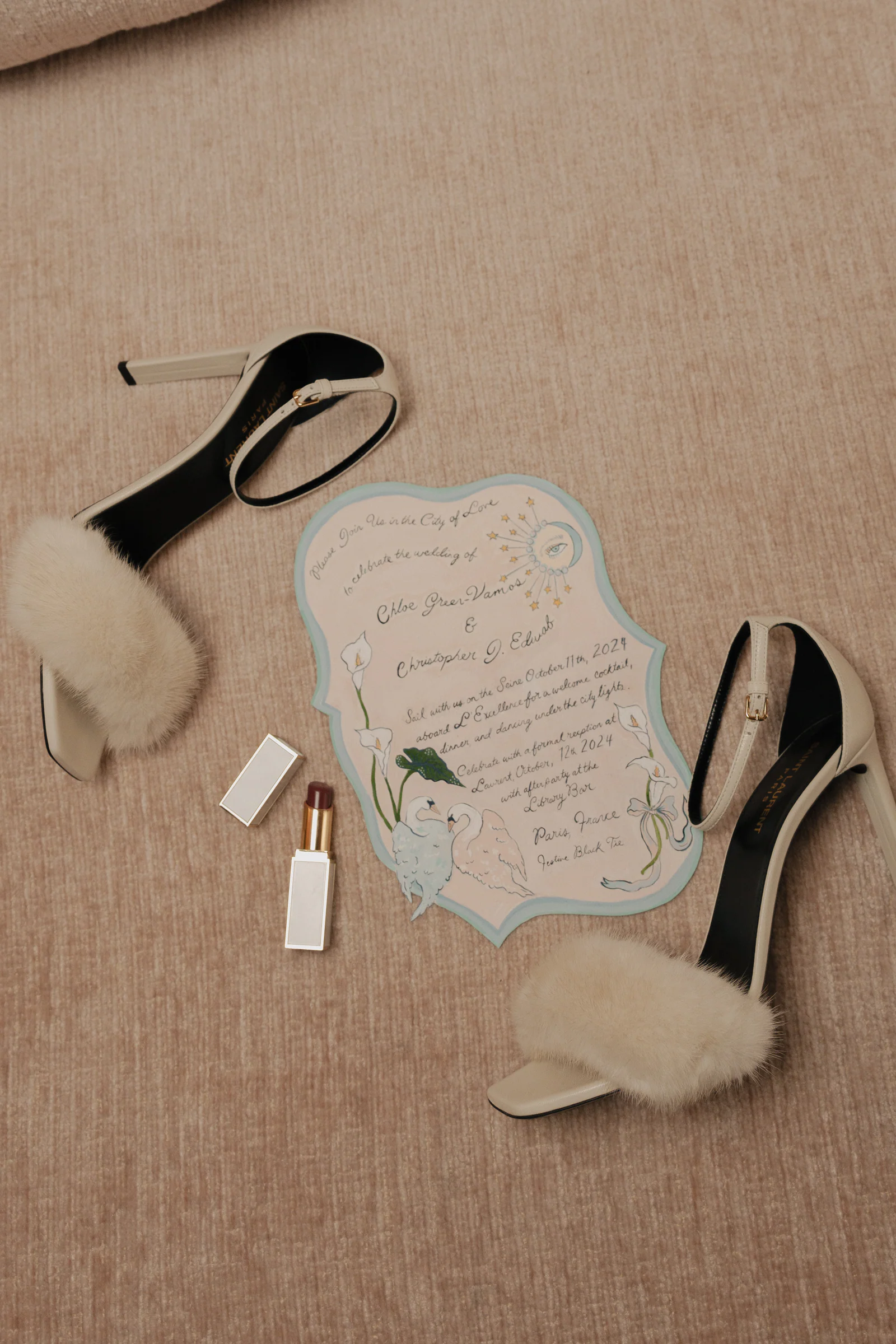 Satin heels, fur stole and the hand-painted invitation, a Paris wedding